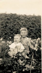 Peter and Terry Glover in the garden, 1952